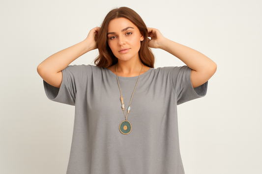 Model with hands in hair showing natural fabric draping